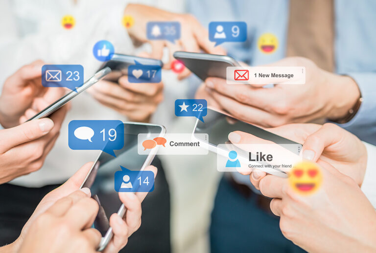 Hands holding smartphones with floating social media notifications for likes, comments, and messages, representing digital engagement.